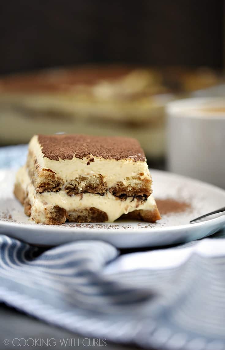 Classic Tiramisu is one of my all-time favorite desserts! Who can resist coffee soaked ladyfingers layered between creamy filling and cocoa powder © COOKING WITH CURLS