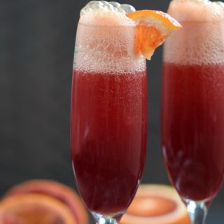 Every celebration needs a signature cocktail, and this Blood Orange Mimosa is perfect addition to your menu! © COOKING WITH CURLS