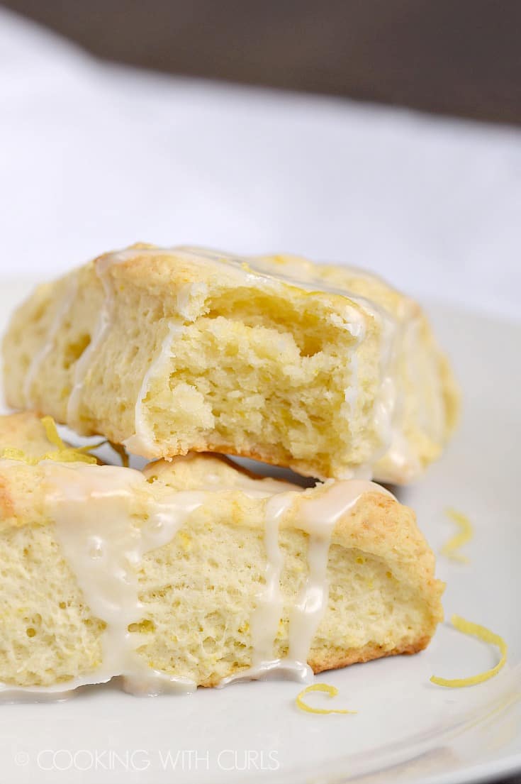 The inside of a flaky lemon scone stacked on top of a second one.