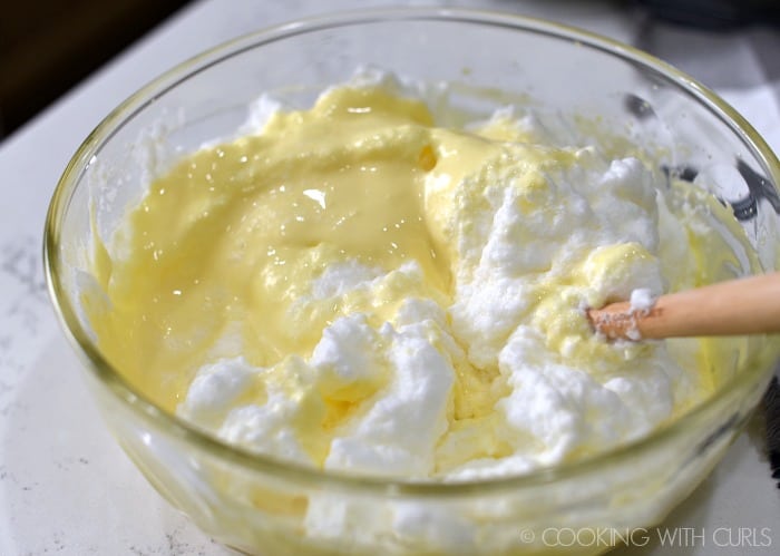 Whipped egg whites folded into the mascarpone mixture.