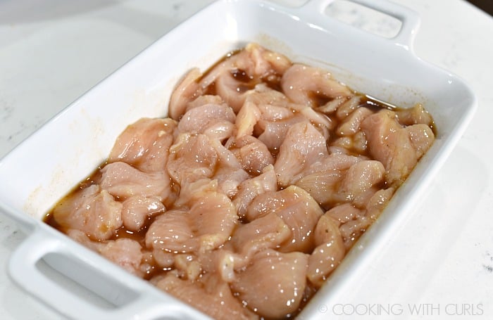 Marinate the bite-size chicken pieces in half of the dressing © COOKING WITH CURLS