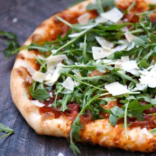 Pizzeria style Prosciutto-Arugula Pizza made at home with simple ingredients and a baking stone! © COOKING WITH CURLS