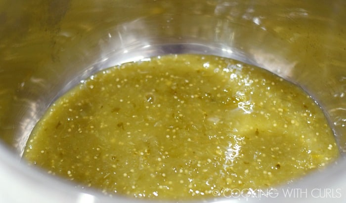 Pour 1 cup of salsa verde into the liner of your pressure cooker © COOKING WITH CURLS