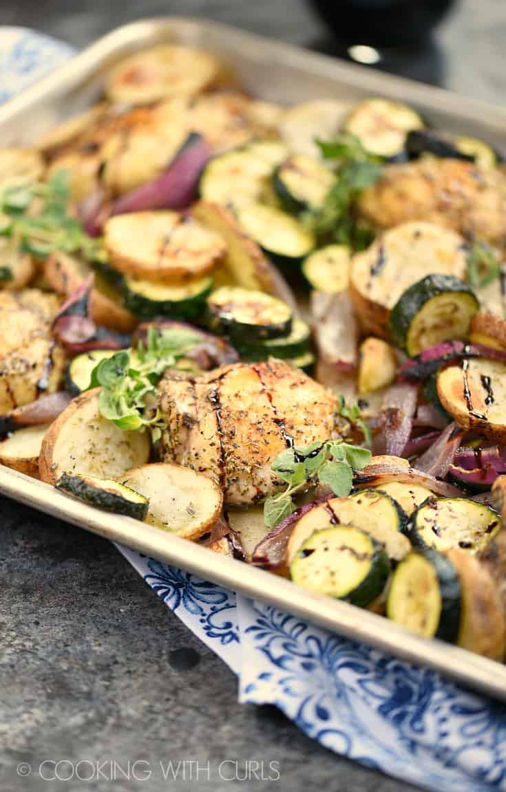 Sheet Pan Greek Chicken Dinner with roasted potatoes and vegetables is a quick and easy meal for any night of the week! Â© COOKING WITH CURLS