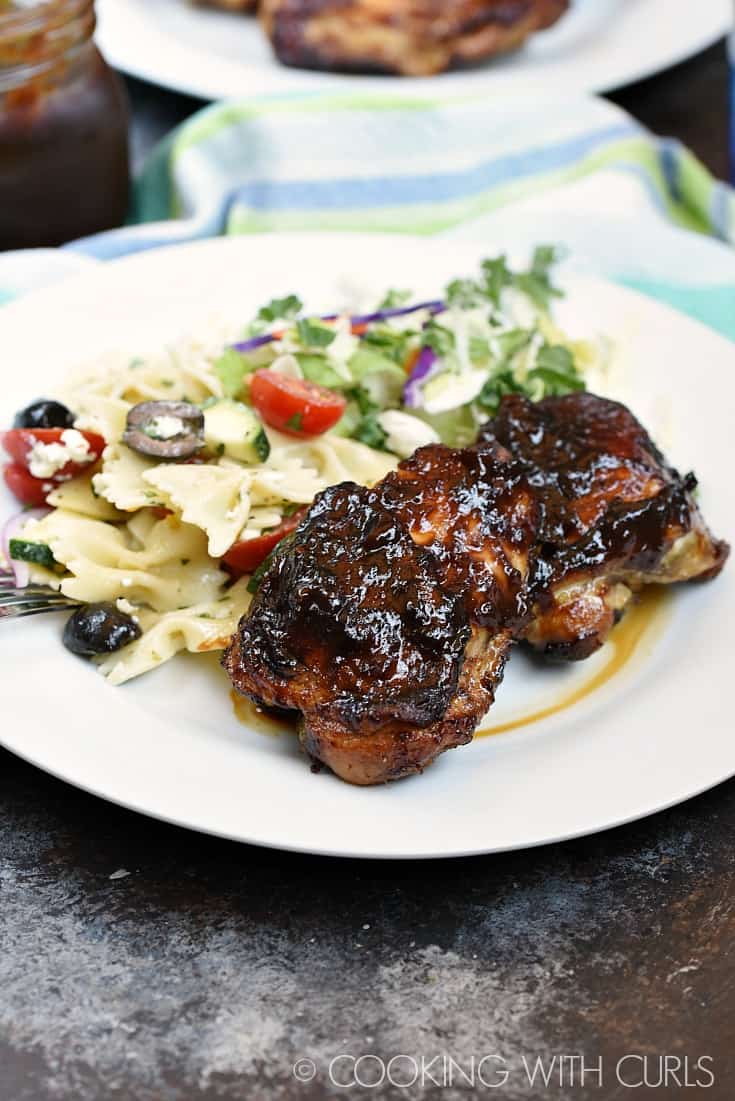 Chicken thighs grilled to perfection and coated with Peach Bourbon Barbecue Sauce © COOKING WITH CURLS