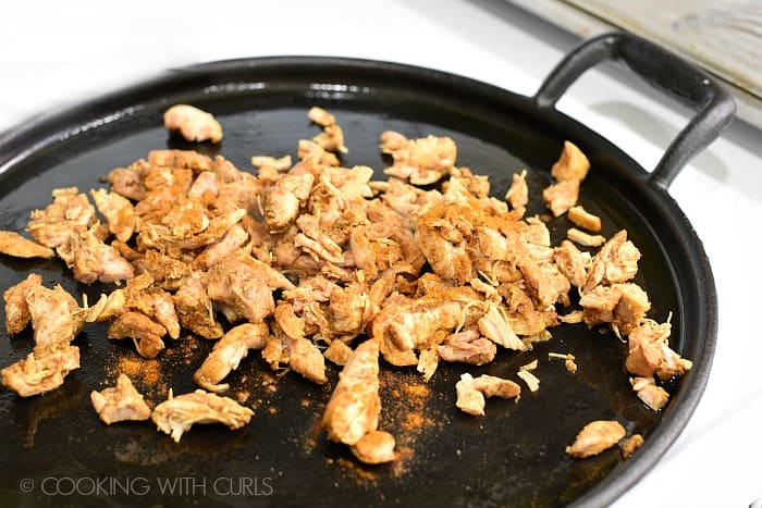 Chopped Chicken Shawarma in a skillet with seasonings. 