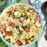 This delicious Mediterranean Pasta Salad is loaded with fresh flavors and it's quick and easy to make! It's the perfect side dish to throw together for your next potluck. © COOKING WITH CURLS