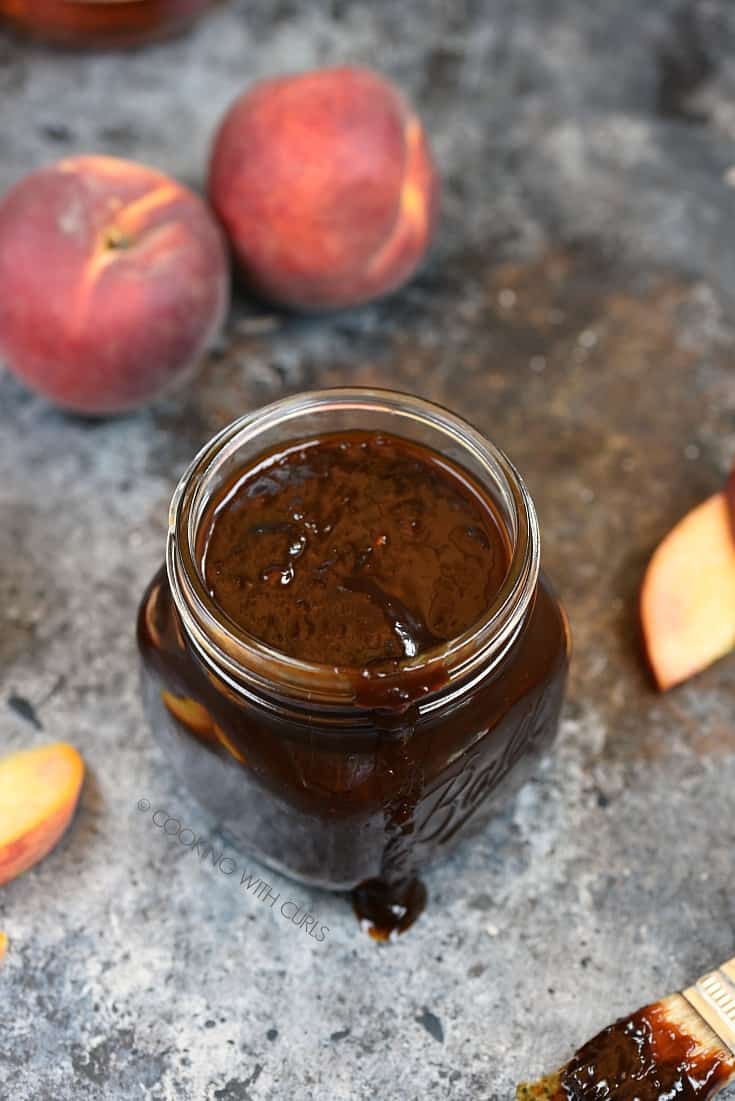 Your summer barbecue just got a boost with the additional of this delicious Peach Bourbon Barbecue Sauce! © COOKING WITH CURLS