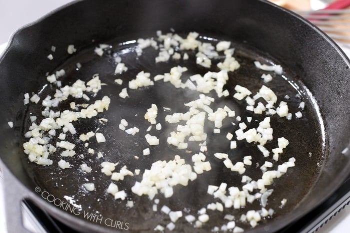 Cook finely chopped onions in a large skillet © COOKING WITH CURLS