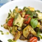 These Charred Summer Vegetables are cooked in a cast iron skillet, topped with basil and shaved cheese for a deliciously healthy meal! © COOKING WITH CURLS