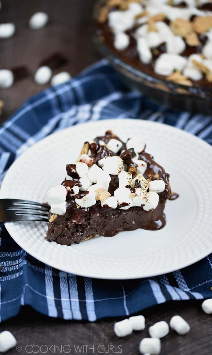 This S'mores Ice Cream Pie combines the flavors of your favorite summertime treat into an ice cold dessert! © COOKING WITH CURLS