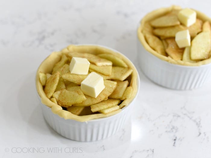 Fill the ramekins with the apple filling and dot with butter cookingwithcurls.com