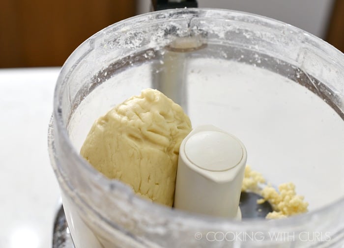 Pie Crust dough in the food processor bowl cookingwithcurls.com
