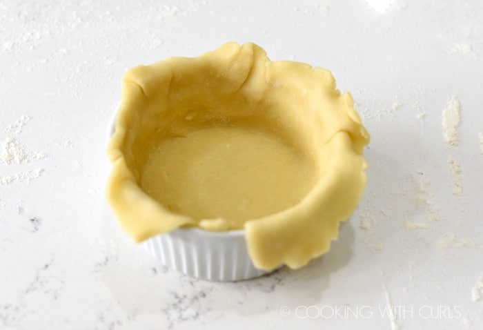 Press the pie crust into the ramekin and trim the edges cookingwithcurls.com