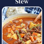 A pot of beef stew with potatoes and carrots in rich gravy with title graphic across the top.