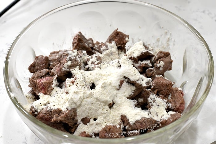 Toss the browned beef cubes with flour in a large bowl.