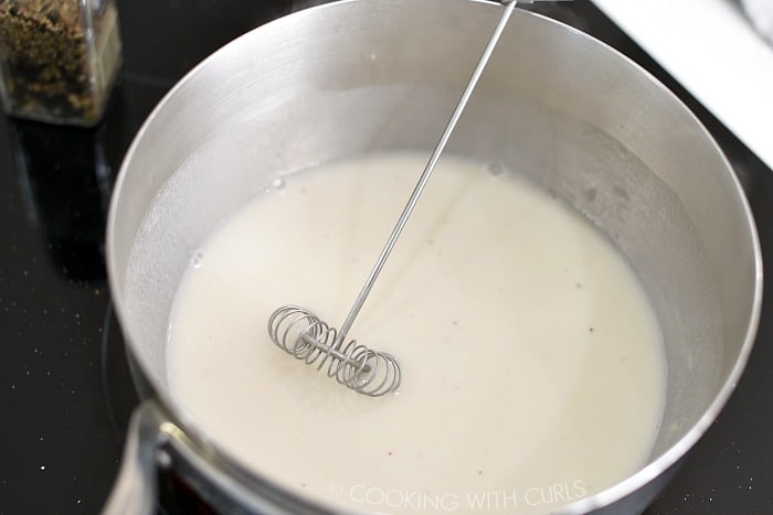 Whisk in the milk to create a thick sauce cookingwithcurls.com