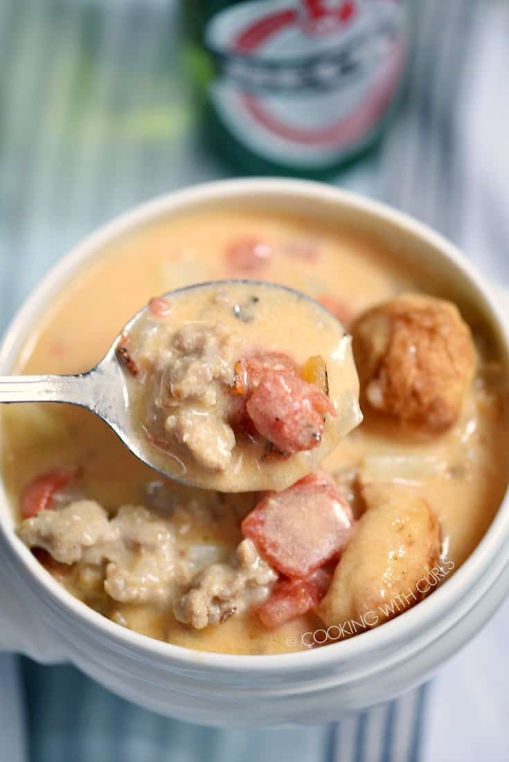 A creamy cheese base loaded with beer brats, onions, and tomatoes combine to create this amazing Beer Brats and Cheese Chowder! cookingwithcurls.com