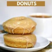Two stacked maple glazed donuts on small white plate with a cup of coffee in background with title graphic across the top.