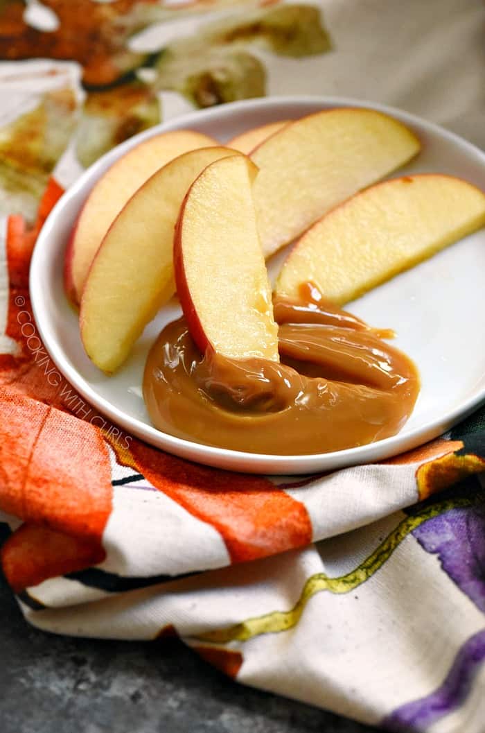 Instant Pot Dulce de Leche is super simple to make and goes perfectly with apple slices, pretzels and cookies! cookingwithcurls.com
