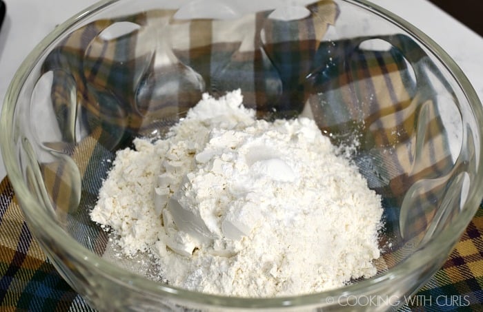  flour, sugars, baking powder, salt, and cinnamon in a glass bowl.