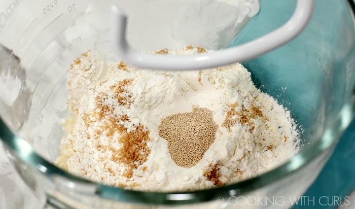 Mix the water, flour, salt, sugar, and yeast together in a mixing bowl with a dough hook cookingwithcurls.com