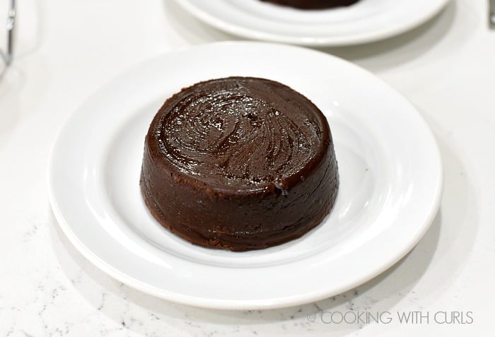Perfectly cooked Chocolate Lava Cakes on dessert plates cookingwithcurls.com