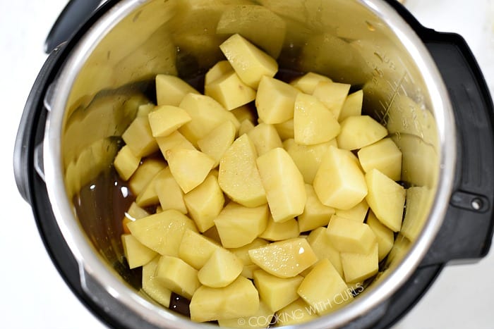 Place the chopped potatoes and vegetable stock in the liner of a pressure cooker cookingwithcurls.com
