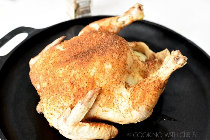 Place the cooked chicken on a baking sheet cookingwithcurls.com