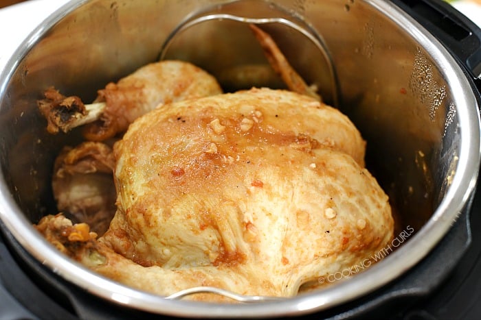 Remove the lid to reveal your perfectly cooked chicken.