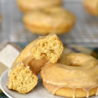 These Maple Glazed Donuts are baked, not fried, and topped with a sweet, buttery glaze for an amazing treat the whole family will love! cookingwithcurls.com