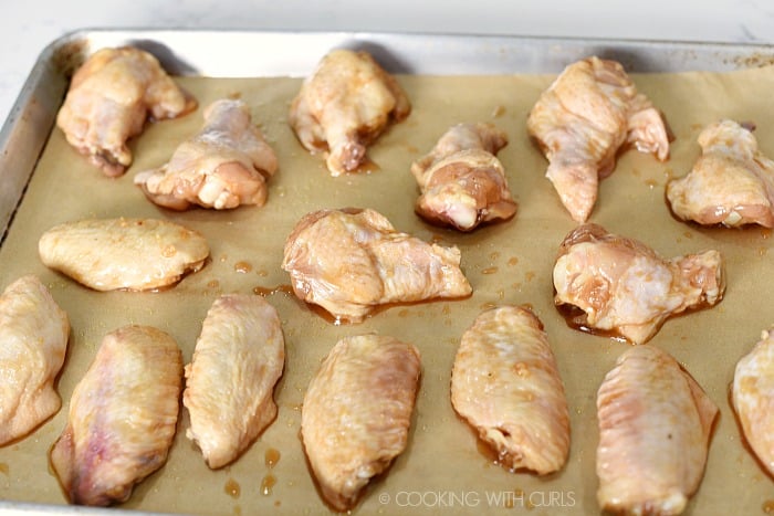 Bake the chicken wings on a parchment paper lined baking sheet cookingwithcurls.com