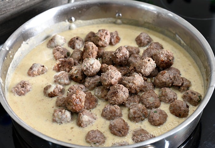 Return the cooked meatballs to the skillet and toss with the gravy cookingwithcurls.com