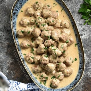 These Swedish Meatballs are cooked to perfection and coated in a thick and creamy pan gravy for the perfect appetizer or family meal! cookingwithcurls.com