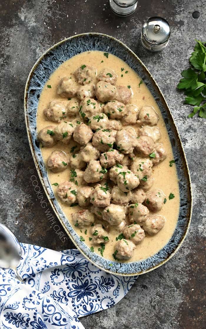 These Swedish Meatballs are cooked to perfection and coated in a thick and creamy pan gravy for the perfect appetizer or family meal! cookingwithcurls.com