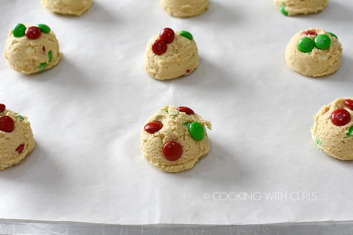 Press additional M&Ms into the tops of the cookie dough cookingwithcurls.com