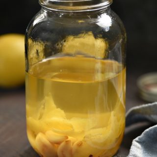 This Garlic and Lemon Infused Olive Oil adds an amazing amount of flavor to vegetables and salads, and it's super easy to make! cookingwithcurls.com
