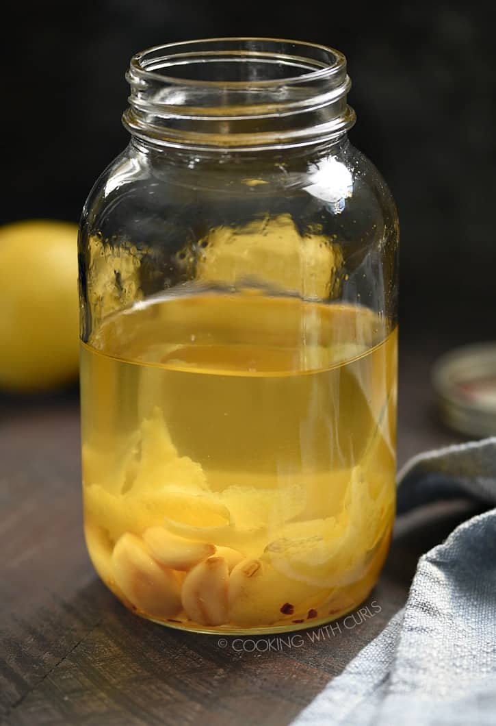 This Garlic and Lemon Infused Olive Oil adds an amazing amount of flavor to vegetables and salads, and it's super easy to make! cookingwithcurls.com