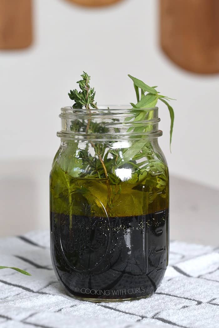 Wine, oil and herbs in a mason jar cookingwithcurls.com
