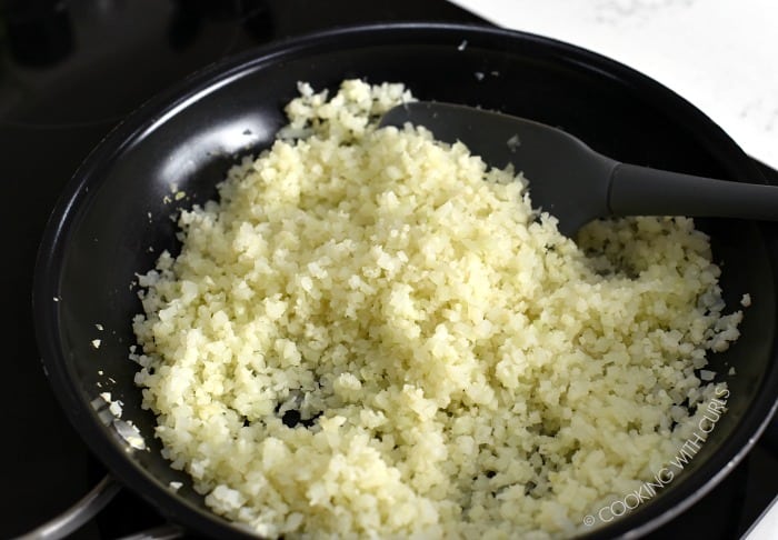 Cauliflower Rice steamed in a skillet.