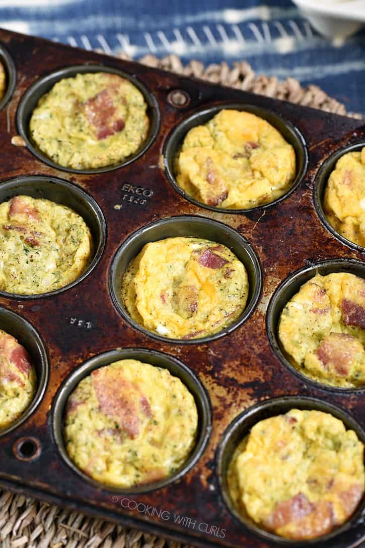 These Breakfast Egg Muffins can be made ahead and reheated for the perfect on the go meal! cookingwithcurls.com