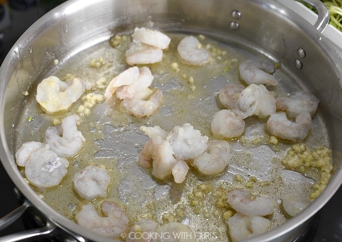 Cook shrimp in the garlic butter in a skillet.