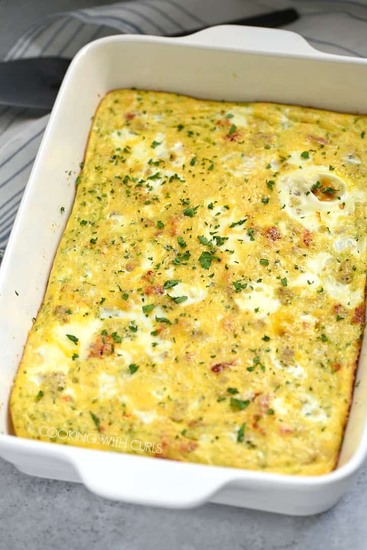 This Low Carb Sausage Egg Casserole featuring homemade Pork Breakfast Sausage and sun-dried tomatoes will become your go-to morning meal! cookingwithcurls.com