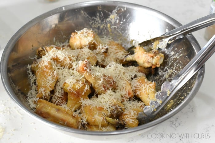 Toss the sauce coated chicken wings with grated parmesan cheese cookingwithcurls.com