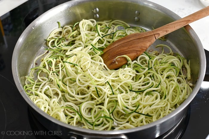 Zucchini noodles sauteed in bacon grease and garlic in a large skillet 