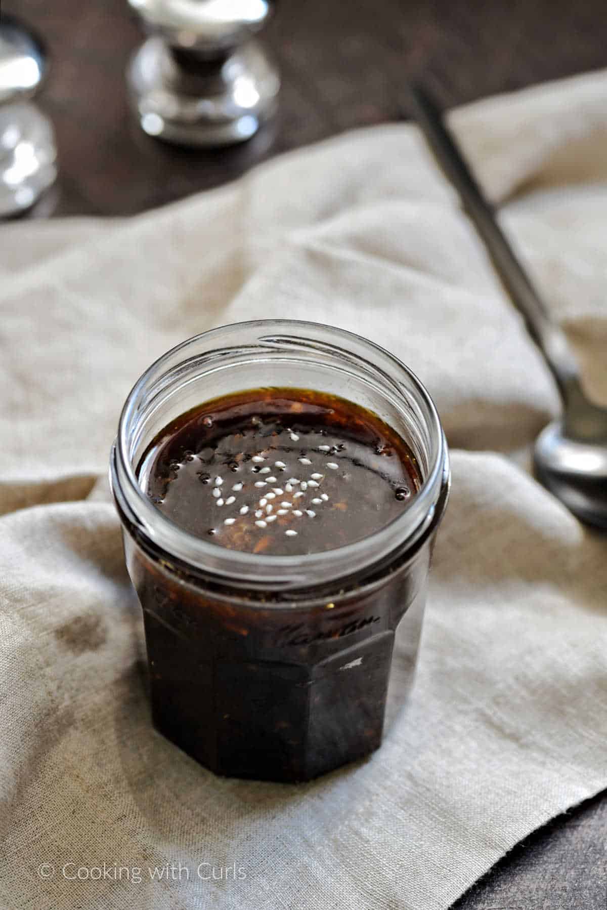 A small jar of sugar free teriyaki sauce.