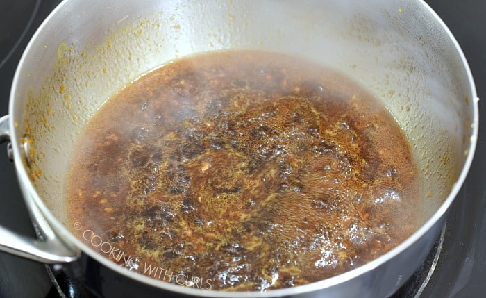 Sugar Free Teriyaki Sauce simmering in a saucepan on the stove. 
