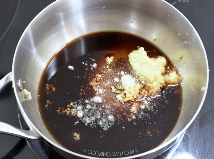 tamari, ginger, stevia, pineapple juice and sweetener in a saucepan on top of the stove. 