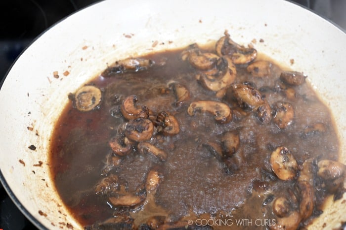 Add the wine to the skillet with the mushrooms and shallots 