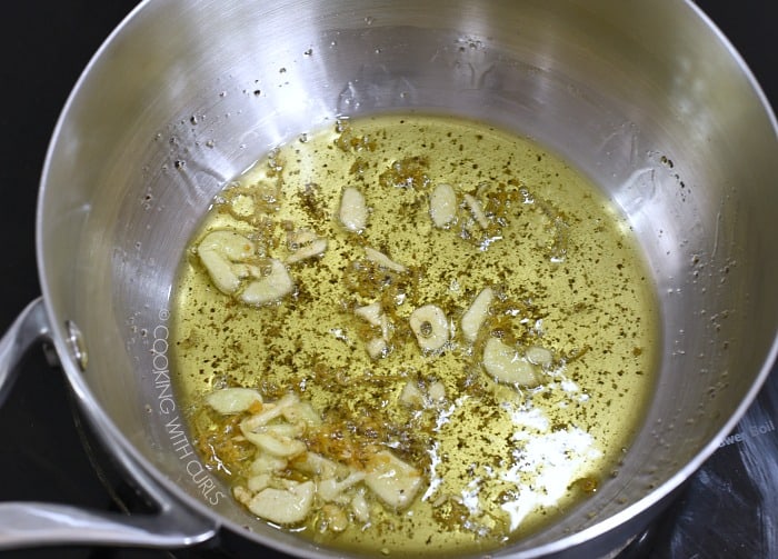 Garlic, lemon zest, pepper and oil in a saucepan 